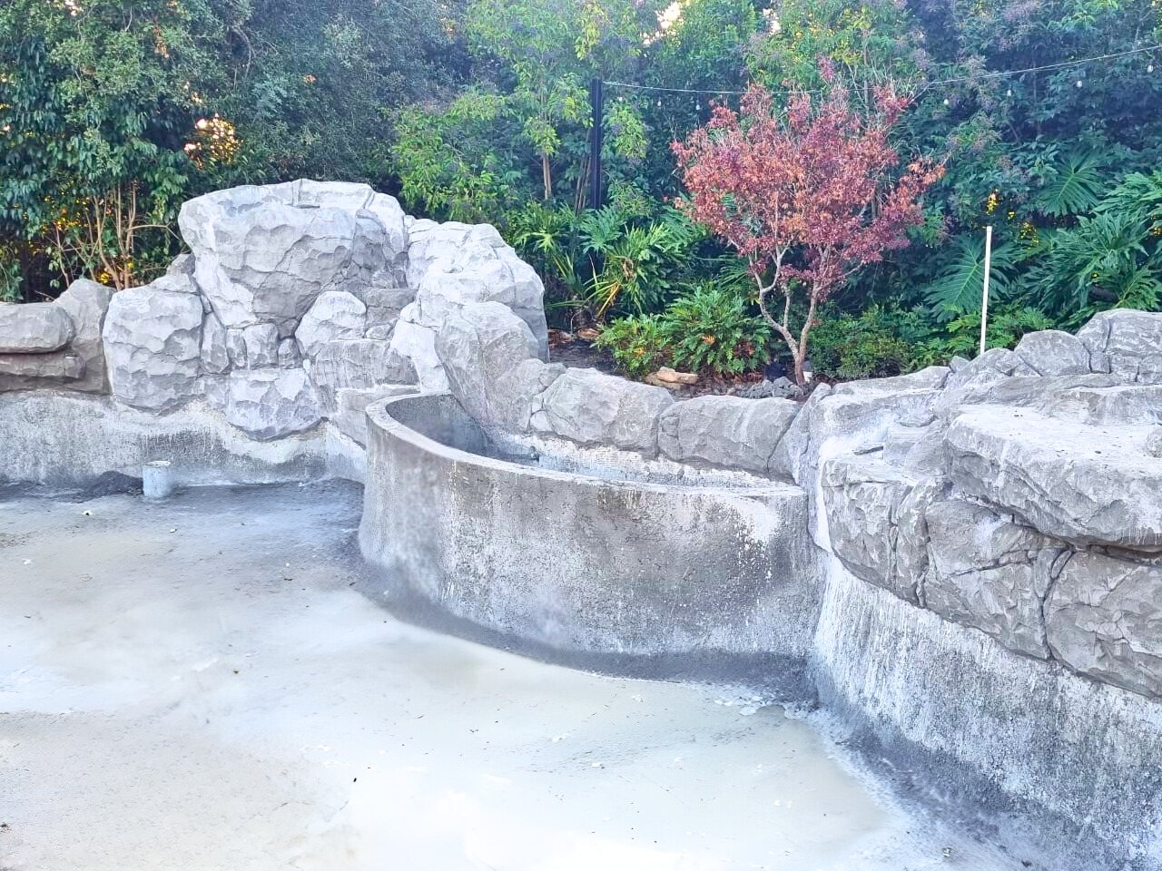 Carved faux-rock shotcrete pond shell before finish coat