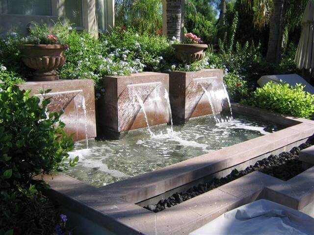 Three block spillway fountains in a commercial planter