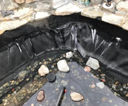 exposed new pond liner during construction 