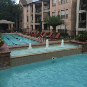 Apartment community pool with fountain jets