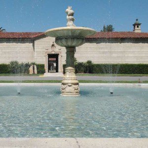 Mission-style tiered fountain in a reflecting pool