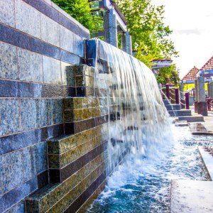 Tiled commercial water wall with sheer descent